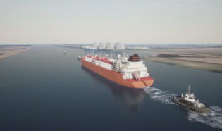 A large red tanker heading toward RGLNG with a small tug boat behind