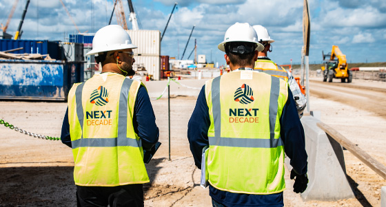 NextDecade construction workers walking on site